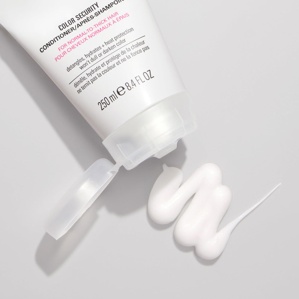 COLOR WOW Color Security Conditioner on shiny hair strands suggests gloss and manageability