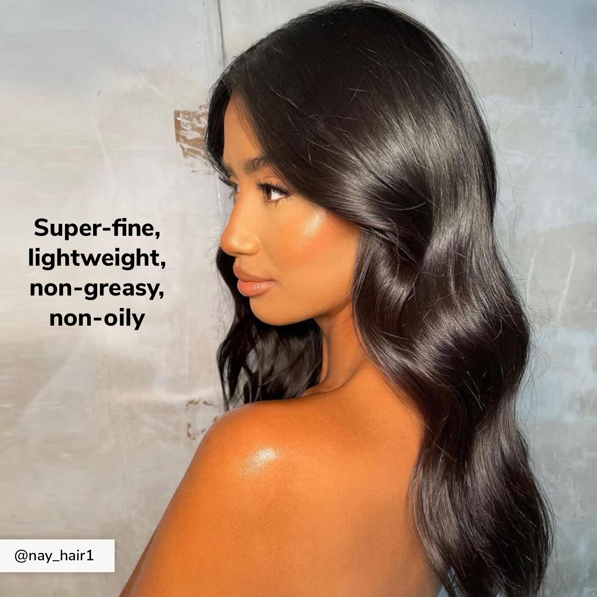COLOR WOW Extra Mystical Shine Spray hands applying for lightweight frizz control.