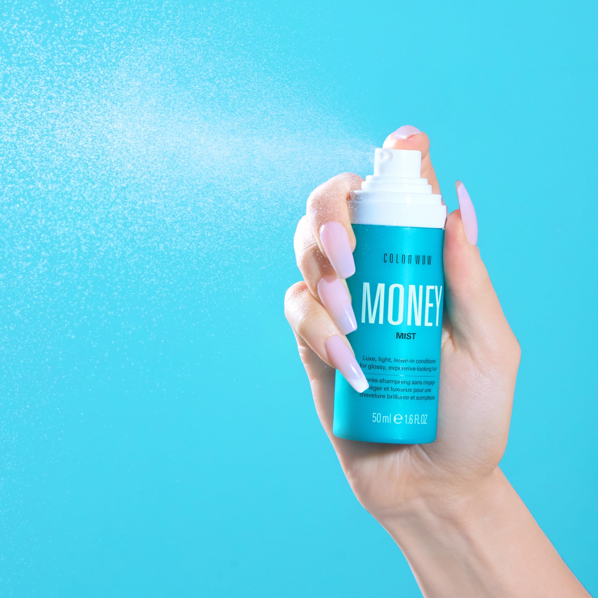 COLOR WOW Money Mist elasticity focus highlighting renewed hair bounce and resilience.