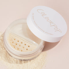 ColourPop No Filter Loose Setting Powder ultra-fine texture seen on skin for crease-free wear.