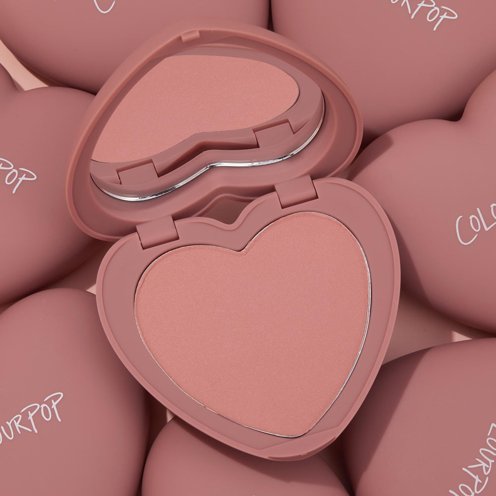 ColourPop Silky Powder Blush Flirt Alert on cheek in natural light