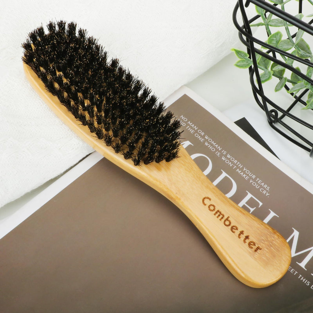 Combetter boar-bristle brush suitable for all hair types including curly and straight.