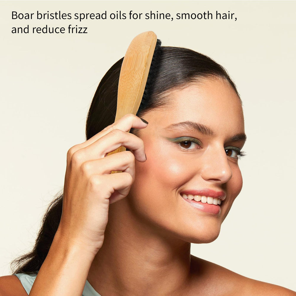 Combetter boar-bristle hair brush aiding precise sectioning and parting.