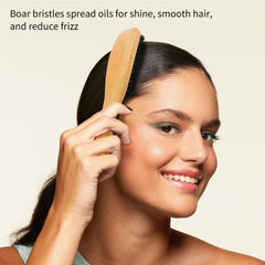 Combetter boar-bristle hair brush aiding precise sectioning and parting.