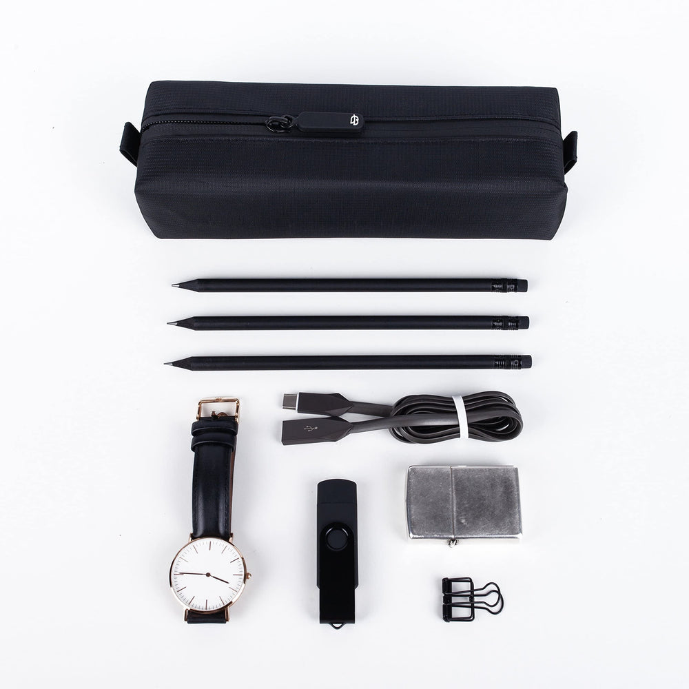 Comfyable empty toiletry bag folded flat for space-saving storage.