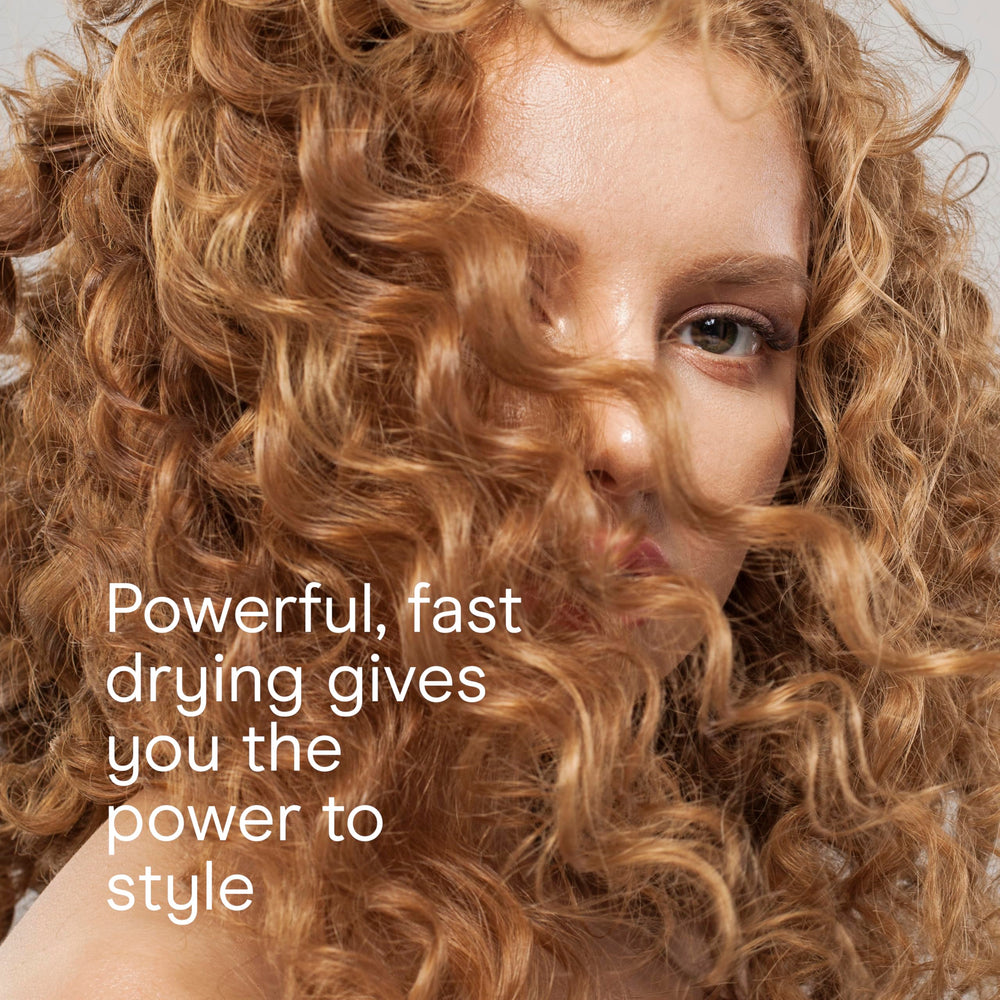 Conair InfinitiPRO ionic technology reducing frizz and boosting shine on textured hair.