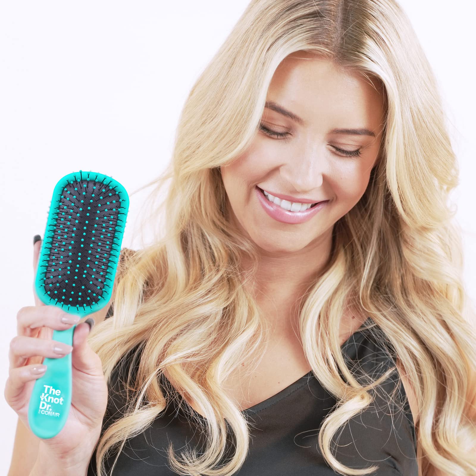Conair Knot Dr. detangler brush designed for easy use during blowouts.