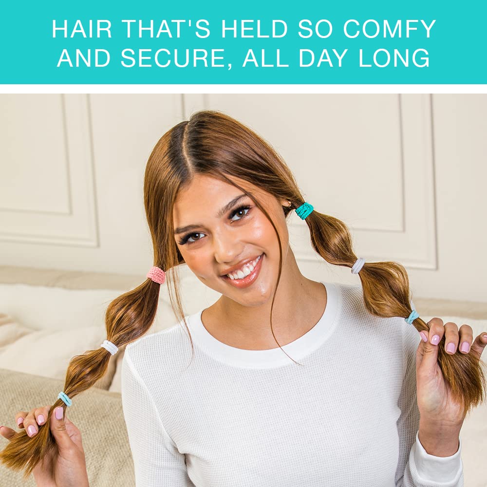 Assorted colors of Conair Scunci No Damage elastics laid out for styling options.