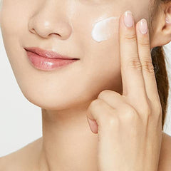 COSRX mask texture swatch on hand highlighting creamy, hydrating overnight formula