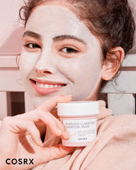 COSRX Pink Pore Clarifying Charcoal Mask spreads evenly for a soothing self-care moment.