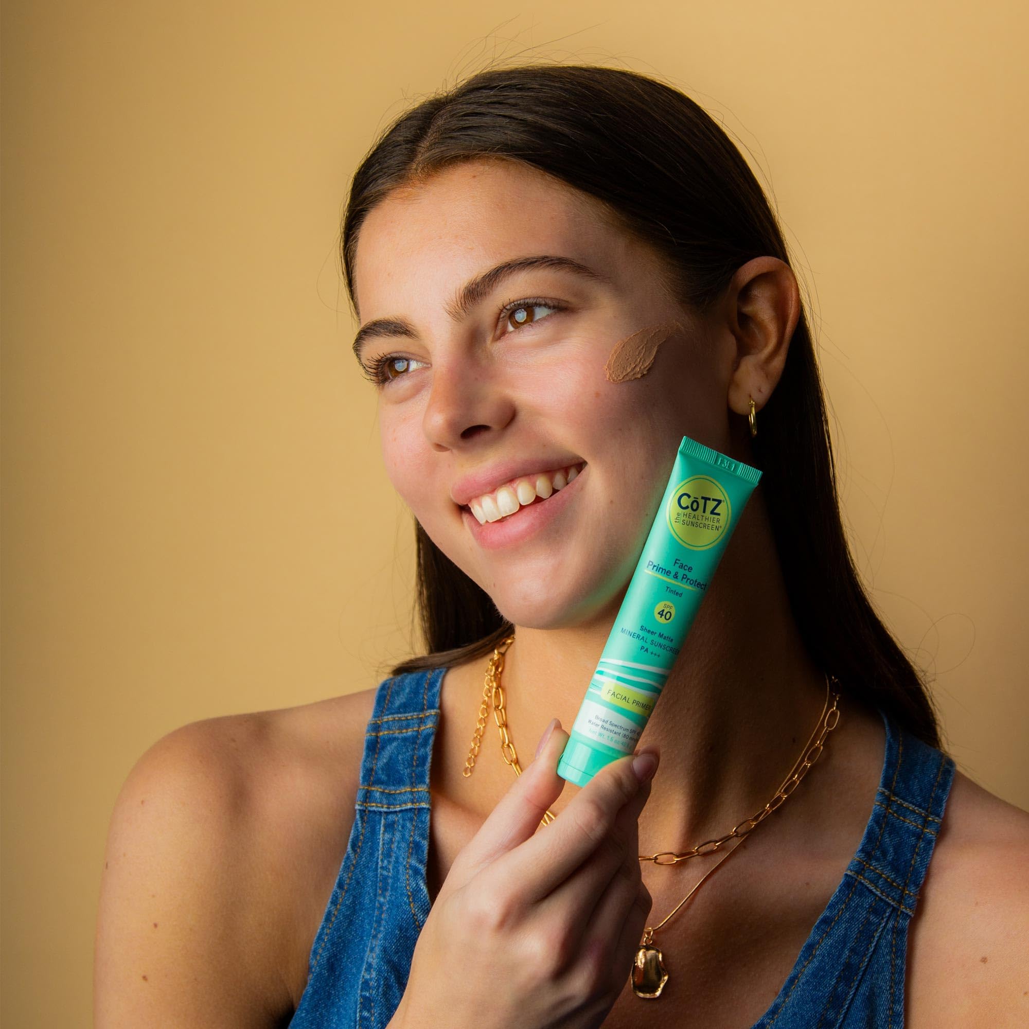 CoTZ bottle beside skincare demonstrates gentle-on-eyes use