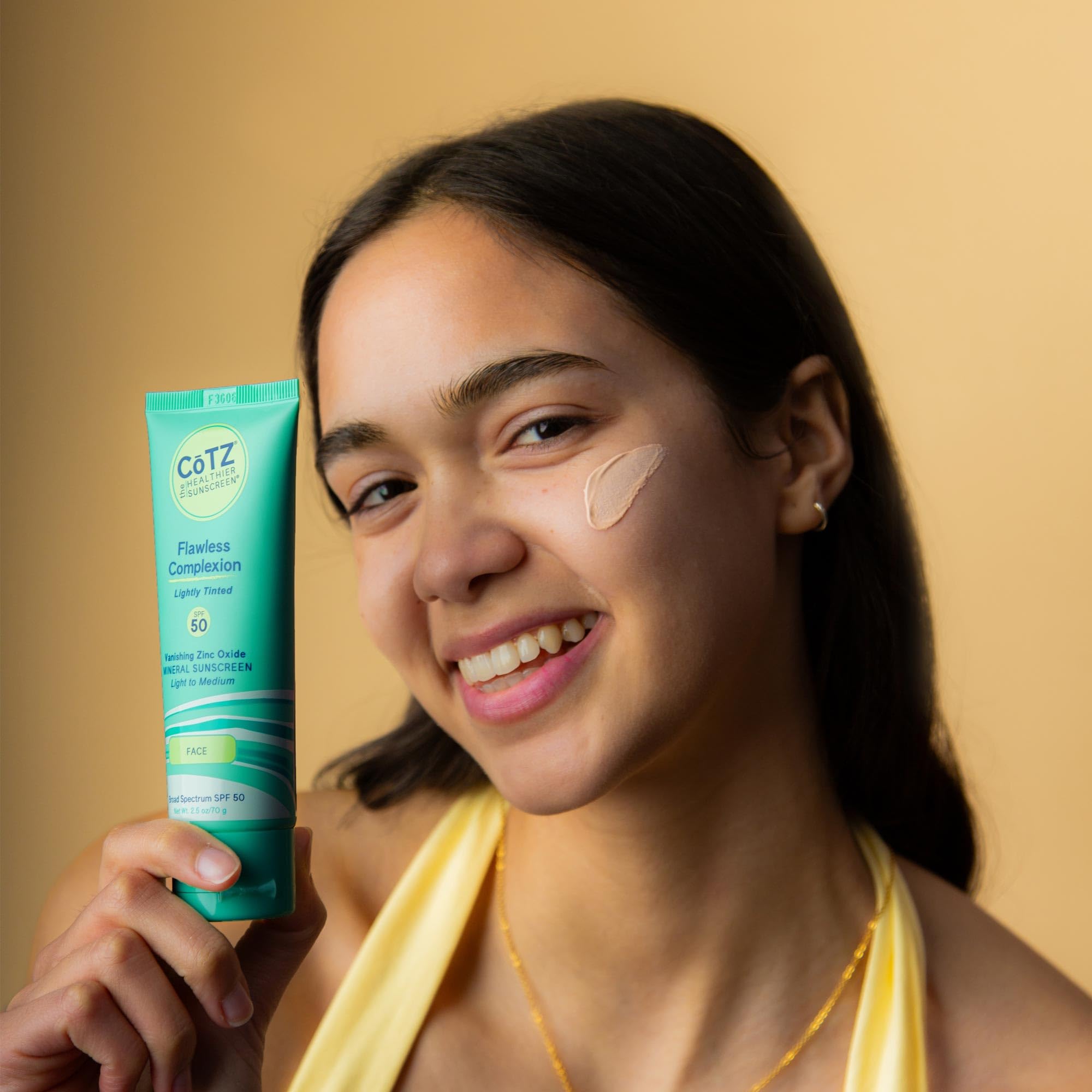 CoTZ lightweight tinted cream on skin reveals smooth texture and easy blend.