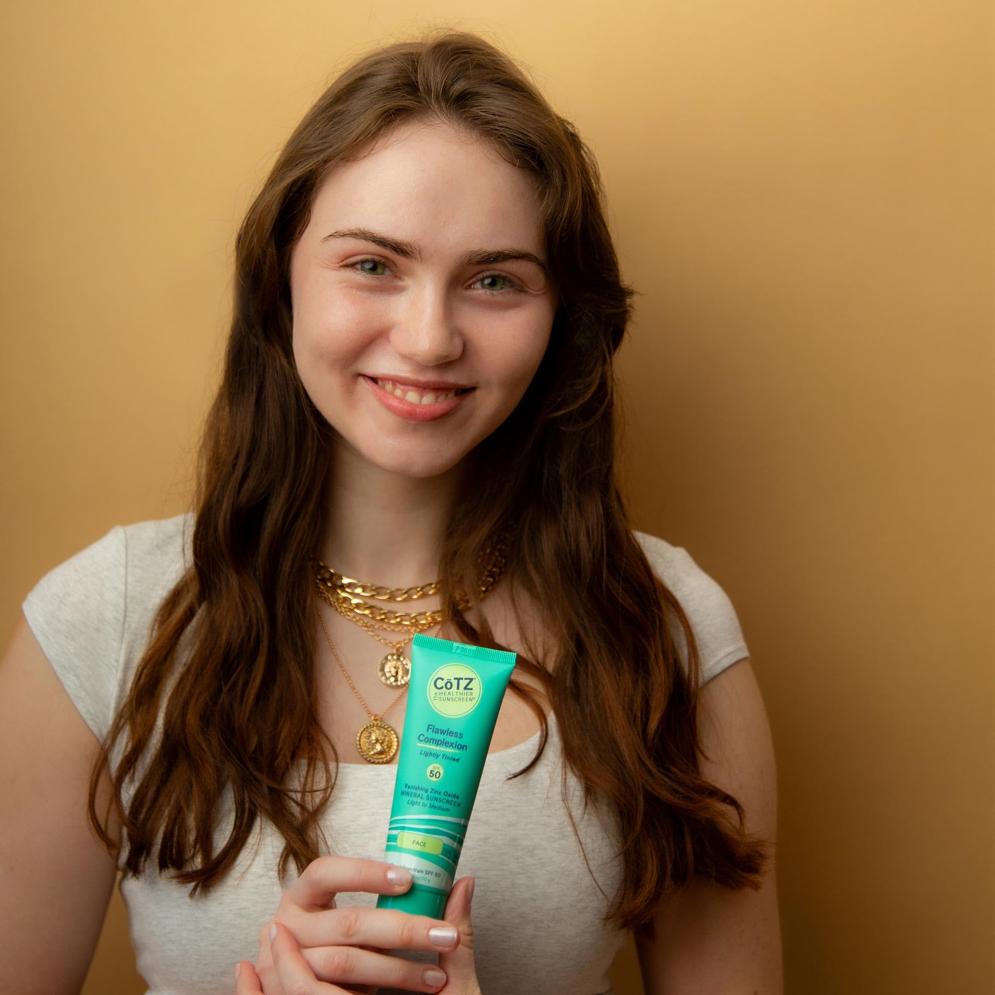 CoTZ moisturizing sunscreen texture on hand demonstrates soothing, hydrating daily use.