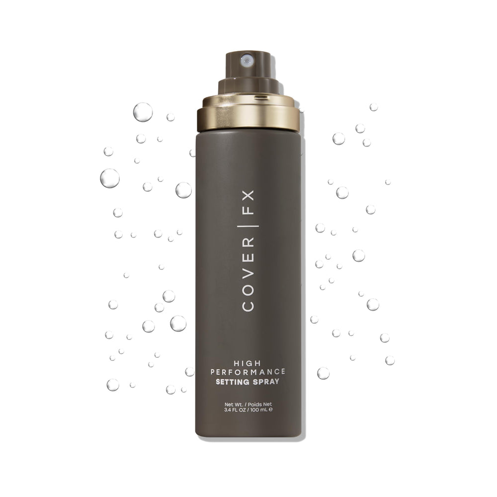 Cover FX setting spray bottle closeup demonstrates all-day makeup hold.