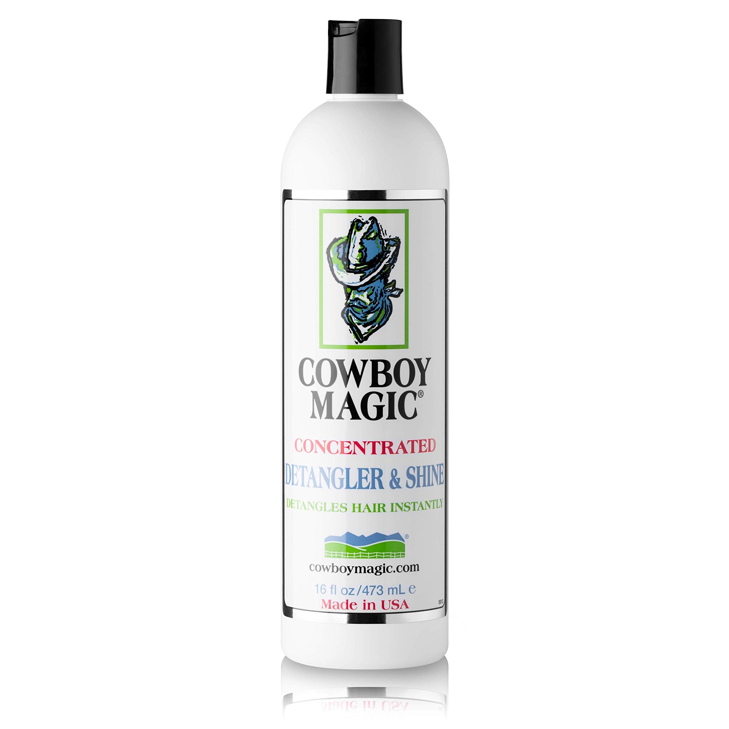 Hands brushing coat with Cowboy Magic for a silky finish.