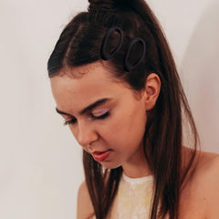 Cptots oval snap clip securing bangs to keep stray hairs in place