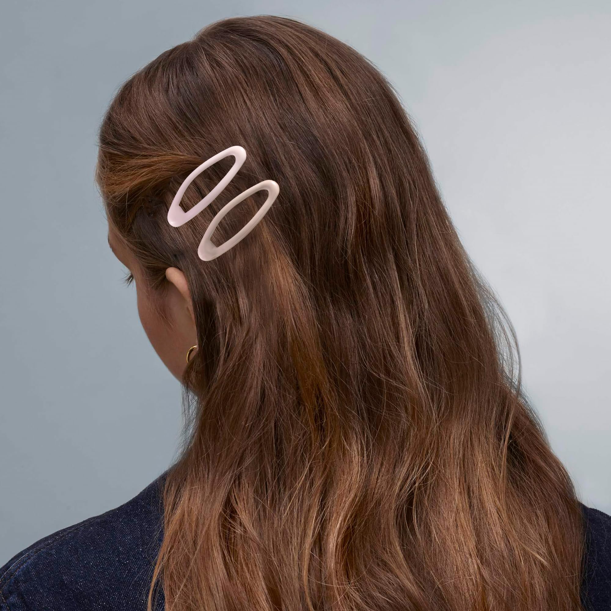 Cptots oval snap clip closeup-metal shows smooth edge for comfortable wear.