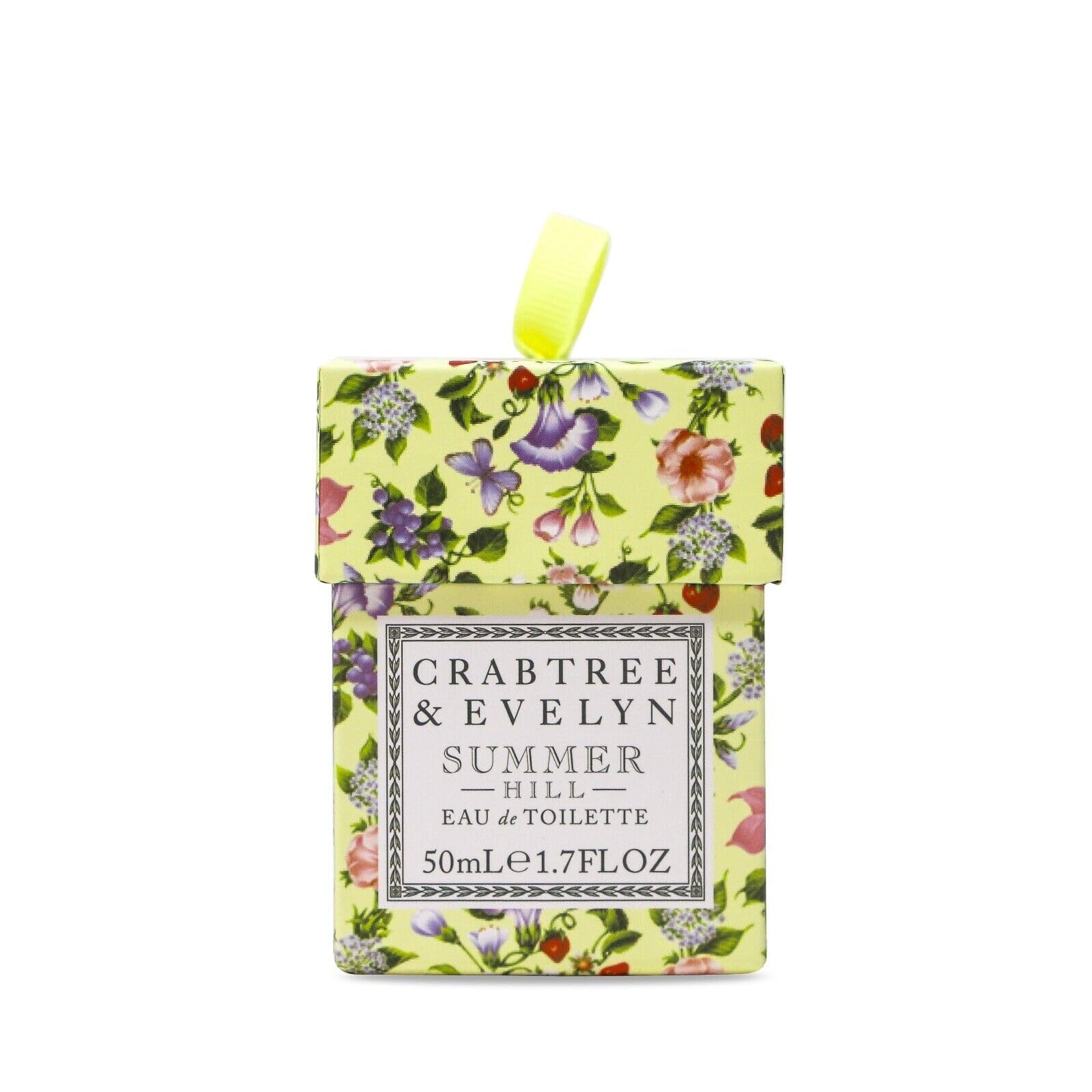 Crabtree & Evelyn Summer Hill fruit-grass scene, suggesting a breezy orchard-inspired scent experience.
