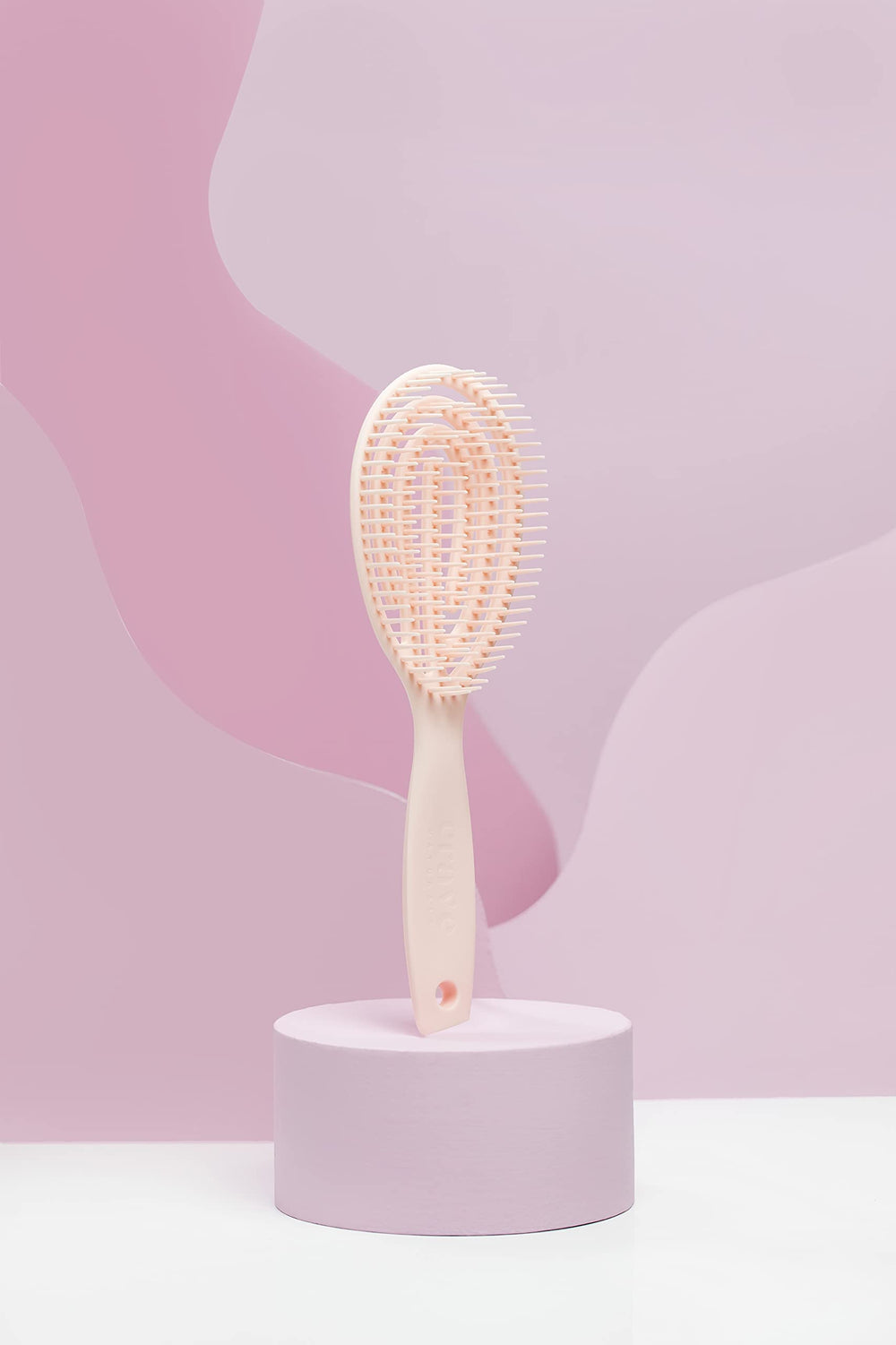 Crave Naturals FLEX DMC detangling brush in dry-use context for knot-free detangling.