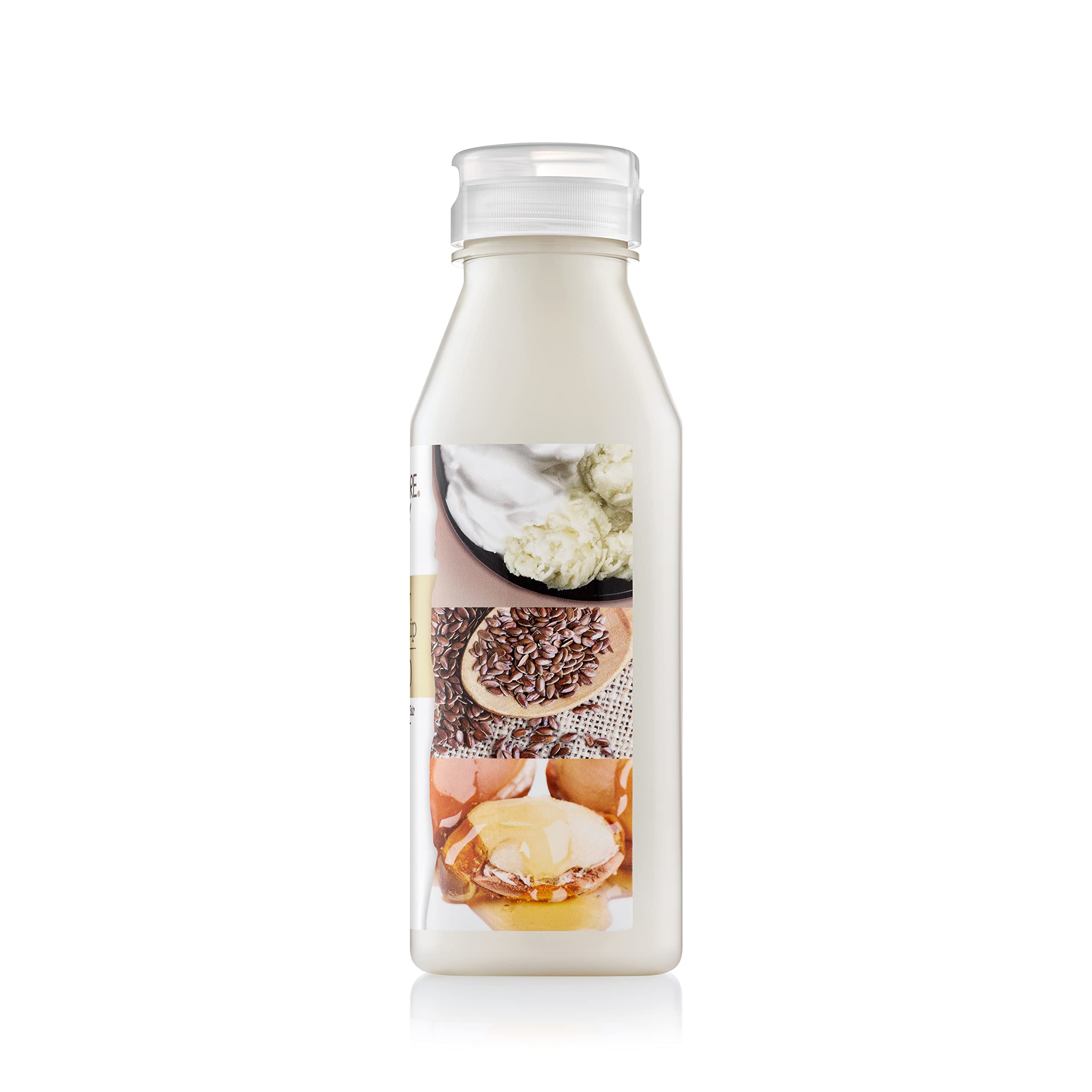 Creme of Nature detangling shampoo close-up highlights conditioning glow from argan oil.