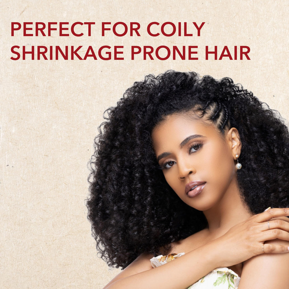 Creme of Nature detangling shampoo bottle with pump demonstrates easy detangling routine.
