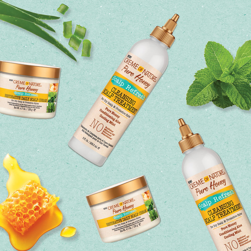 Dry towel removal of buildup shown with Creme of Nature Pure Honey.