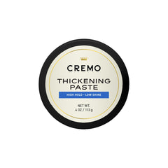 Cremo hair thickening paste packshot highlighting barber-grade styling