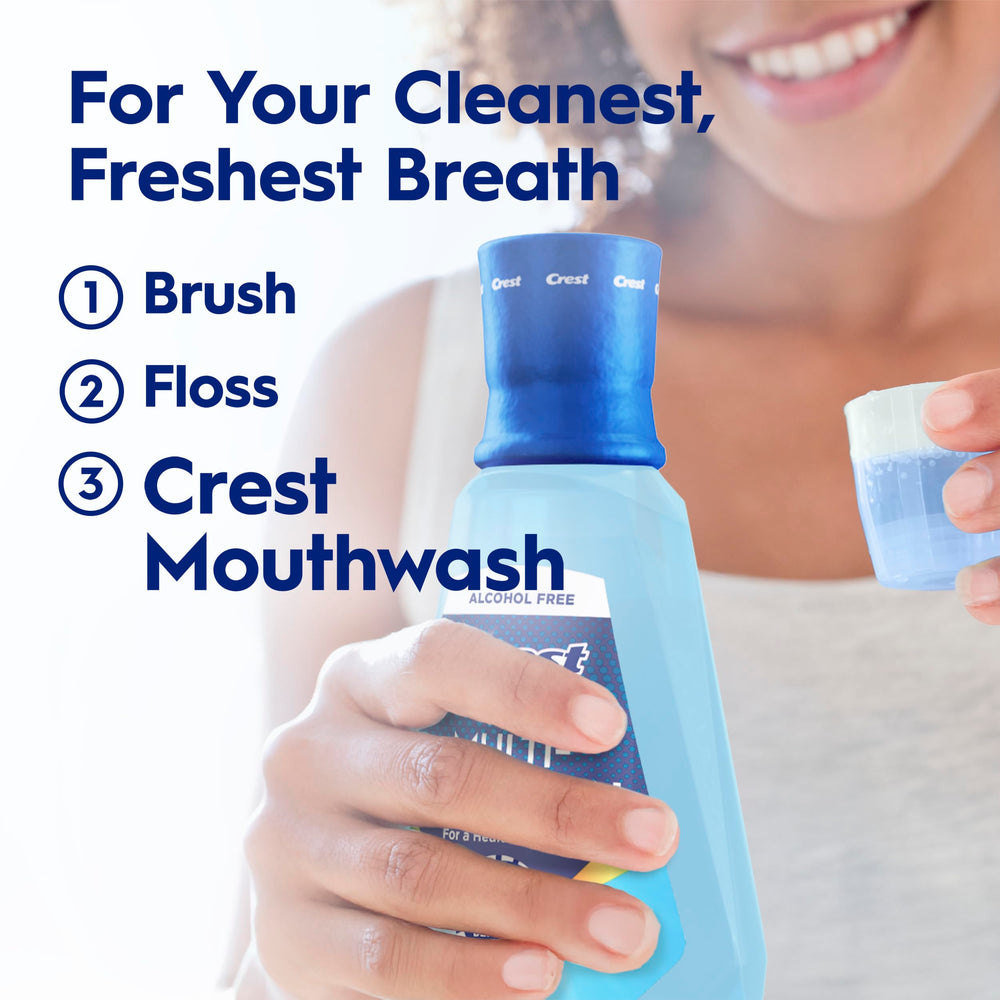 Crest bottle beside toothbrush demonstrating routine complement