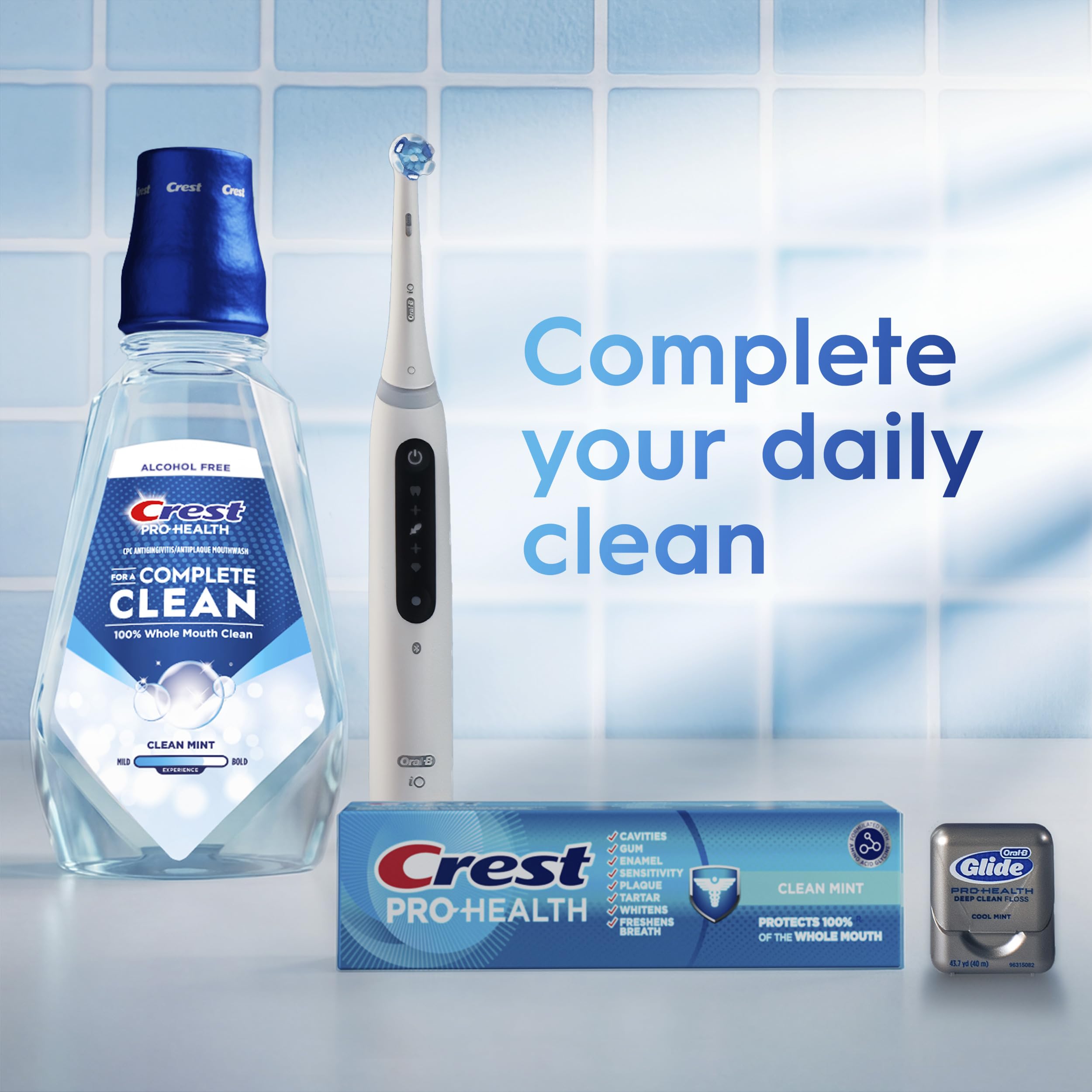 Crest Pro-Health on bathroom shelf among other oral care products