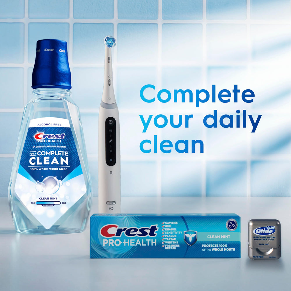 Crest Pro-Health on bathroom shelf among other oral care products