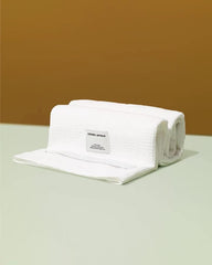 CROWN AFFAIR oversized towel 32x38 provides full-head coverage without weight.