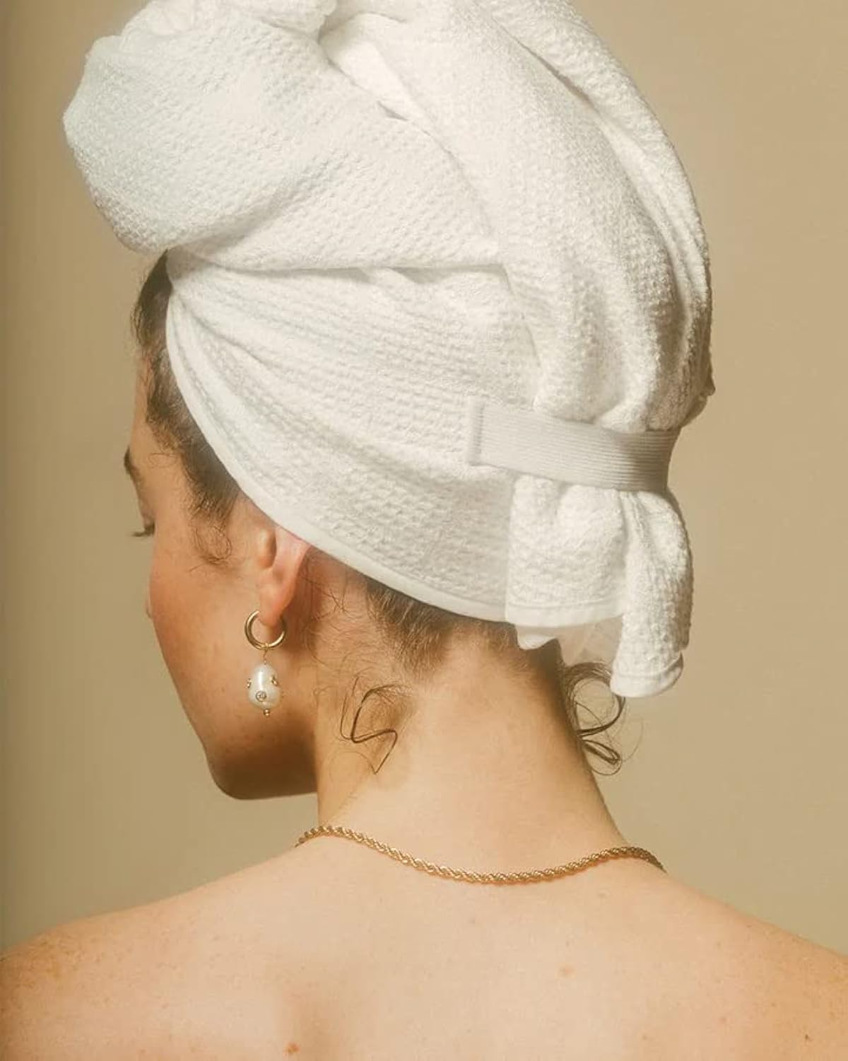CROWN AFFAIR The Towel wrap close-up shows secure wrap for all hair lengths.