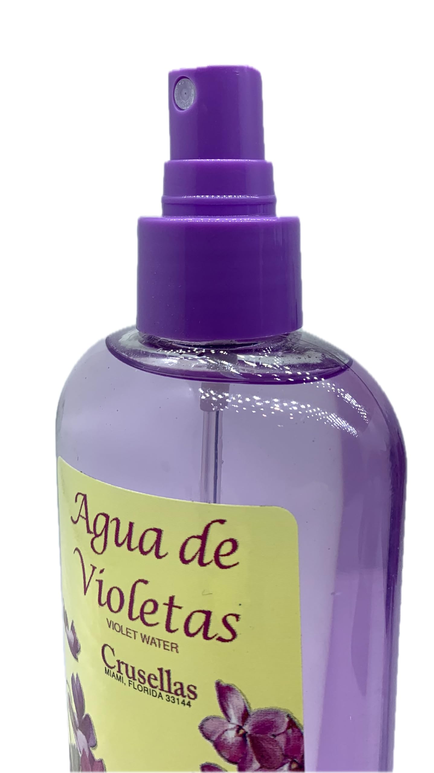 Crusellas Agua de Violetas pump spray on shelf, suggests soothing skin refreshment and calming ambiance.