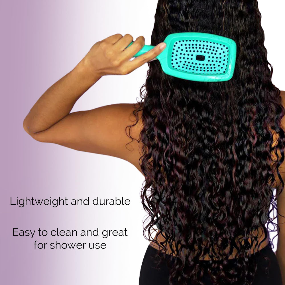 Curl Keeper Flexy Brush turquoise used on wigs or extensions for smooth detangling.