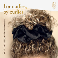 Curlfriend Collective sleep-friendly silk scrunchie preserves waves overnight.