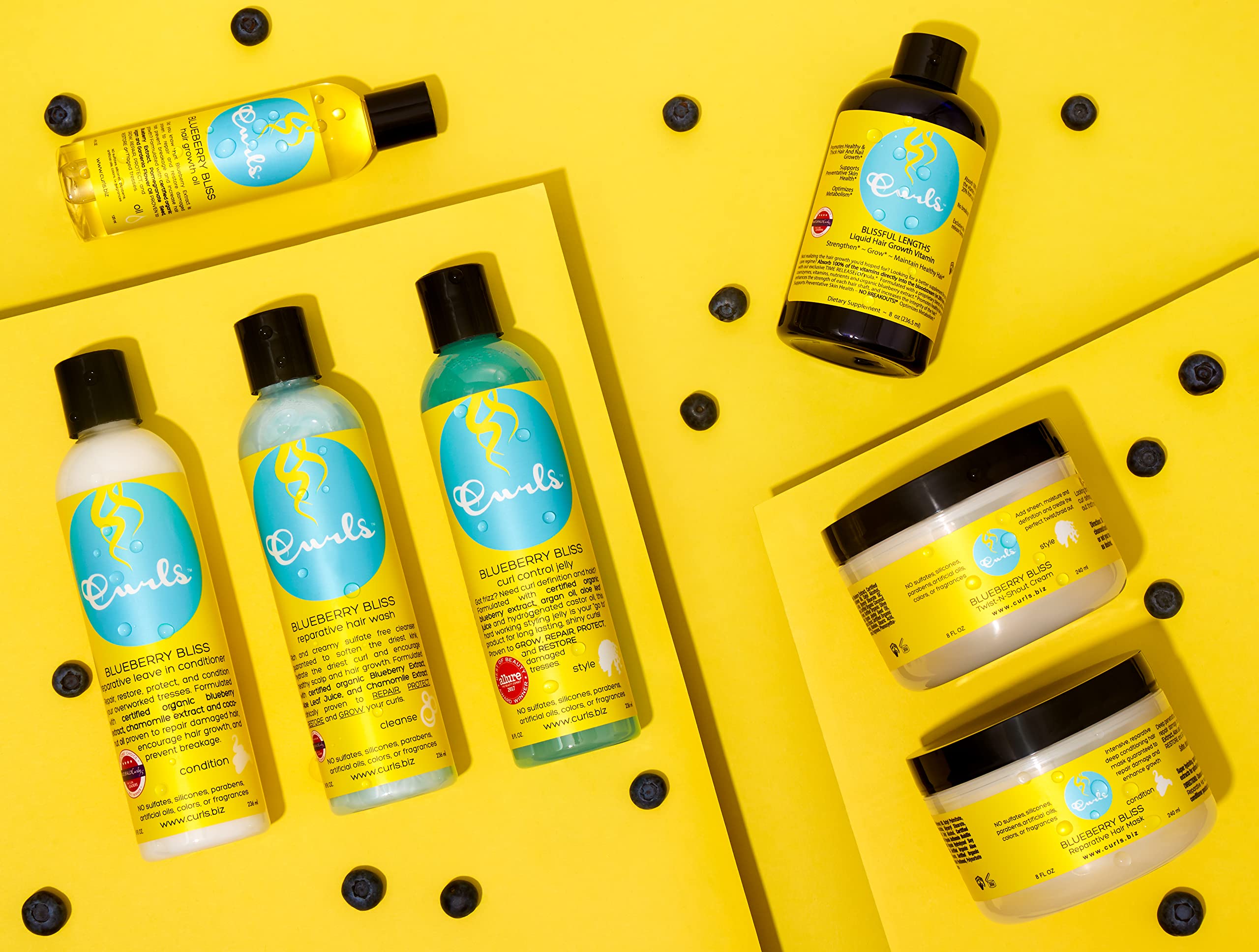 Curls Blueberry Bliss vibrant curls with hydrated, defined texture.