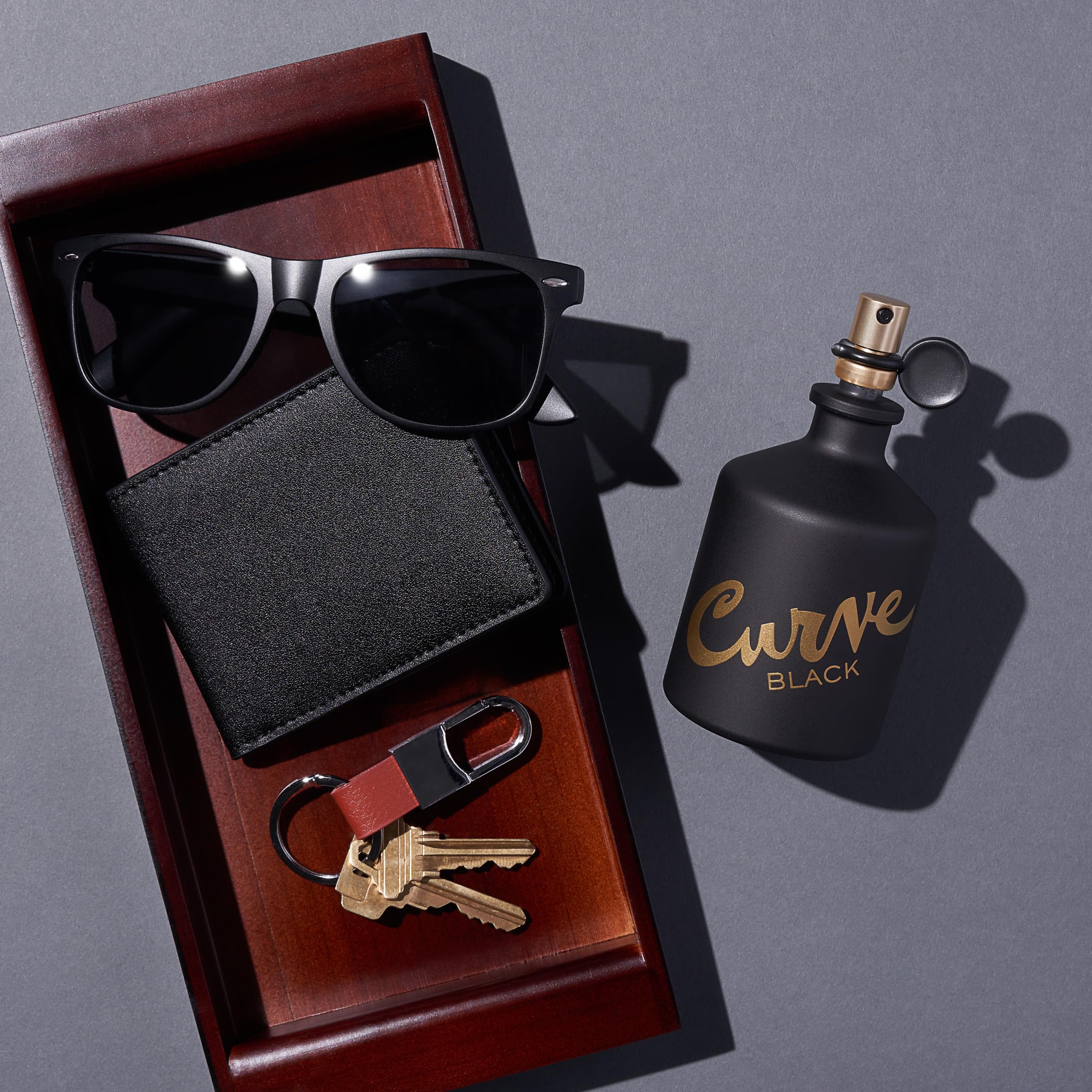 Curve Black for Men brand logo close-up exudes premium lifestyle appeal.