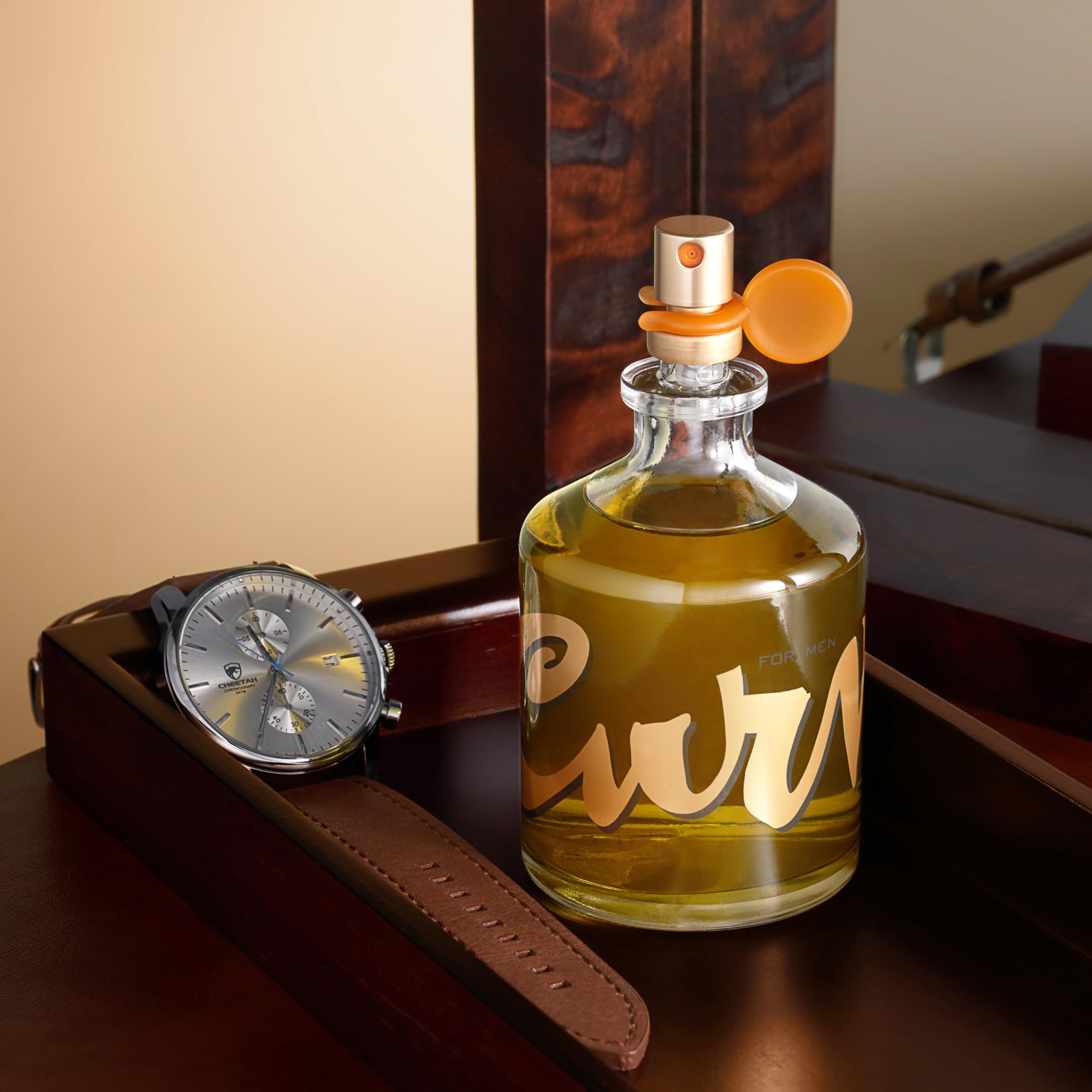 Curve Men's Cologne spray diffusion captured mid-air conveys fragrance projection.