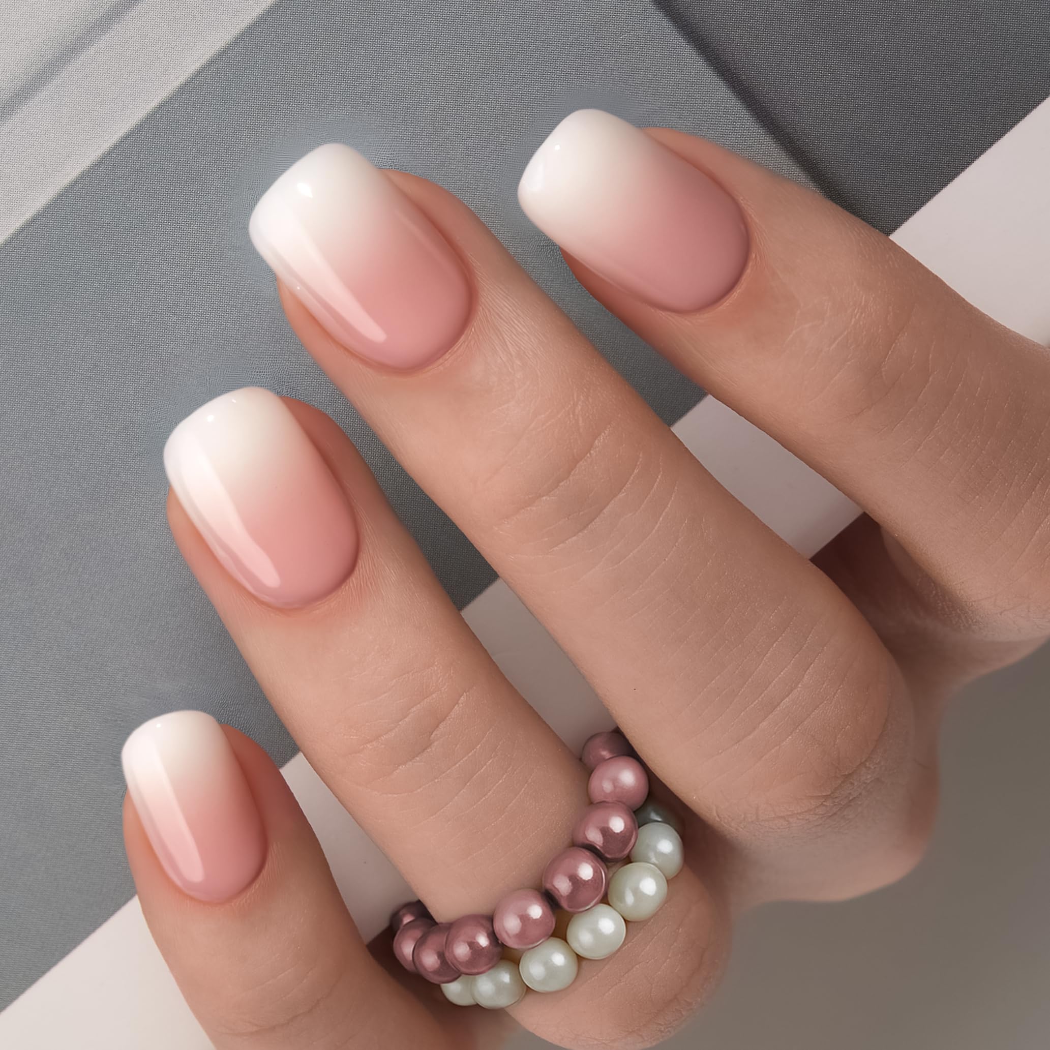 CurvLife Nude Ombre Nails closeup highlights glossy gel finish and smooth edges.