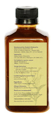 DAANA mustard oil applied to scalp for nourishing massage.