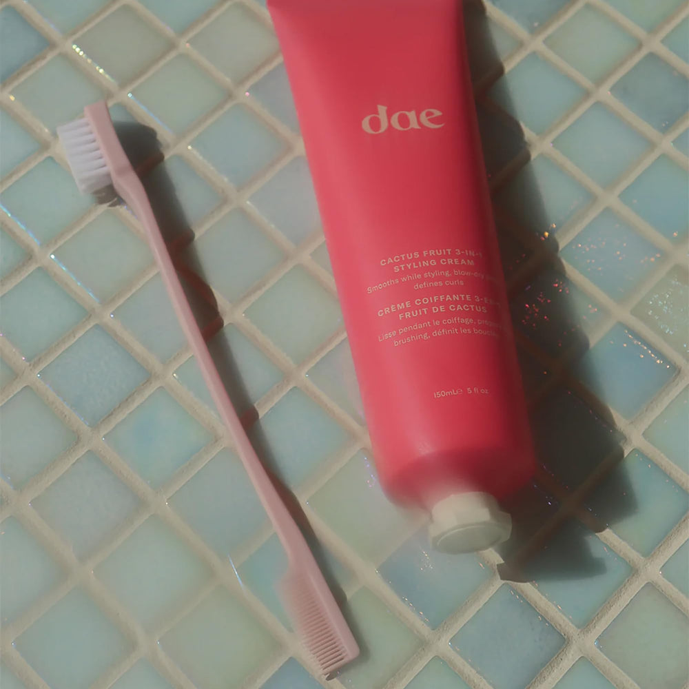 DAE dual-edge styling brush bristle side closeup showing vegan bristles smoothing hair