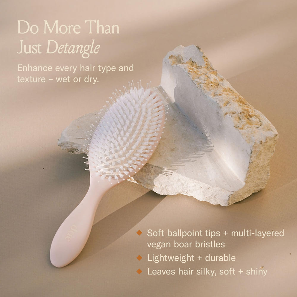 DAE Vegan Detangle Style Brush closeup highlights nylon bristles for scalp massage and shine.