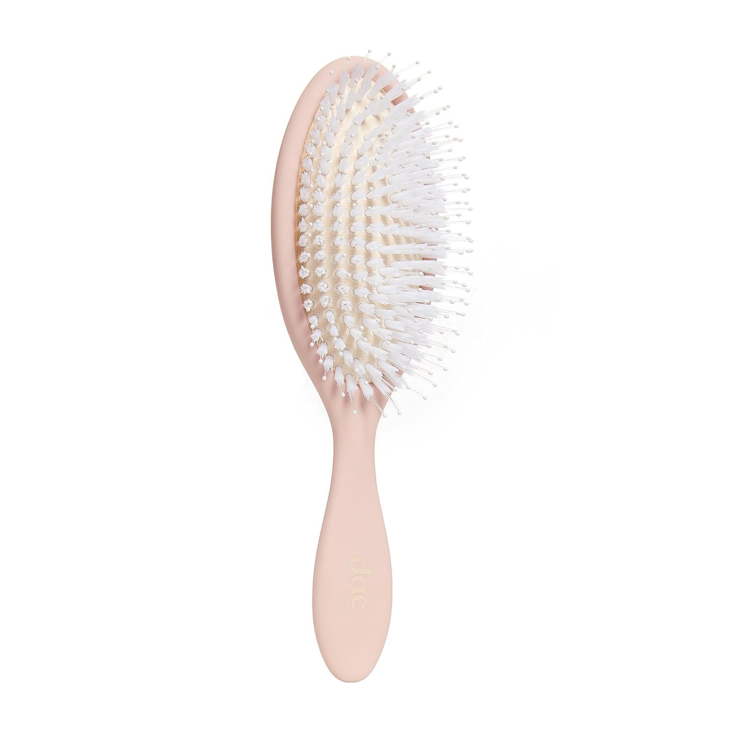DAE Vegan Detangle Style Brush in hand shows gentle detangling for all hair types.