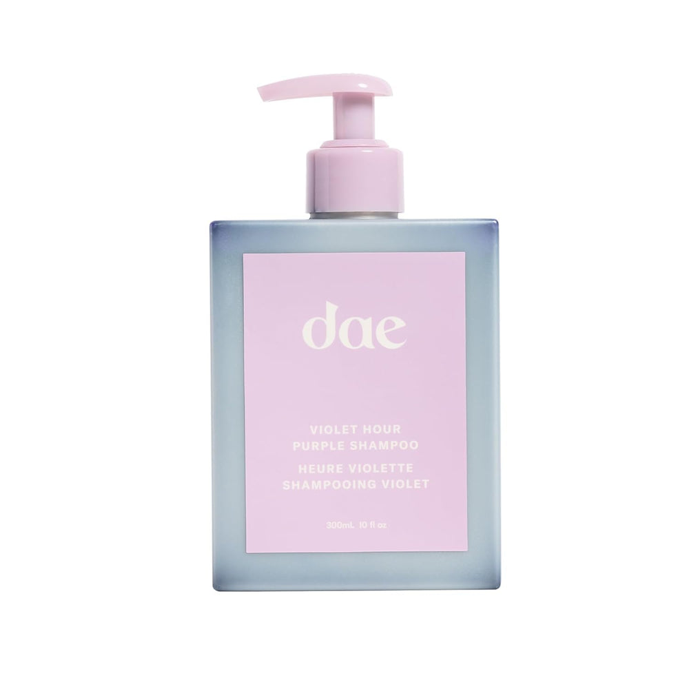 DAE Violet Hour Purple Shampoo bottle shows color-correcting action for brassiness in blonde and gray hair.