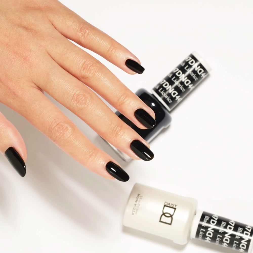 Daisy DND 447 Black Licorice lacquer side view showcases rich color for bold mani ideas.