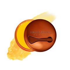 Danessa Myricks Yummy Skin Moisture Repair Balm Jar closeup shows rich, hydrating texture.