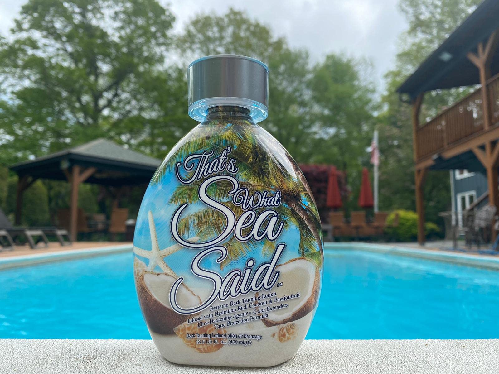 Dark Tans Exclusive That’s What Sea Said tanning-cream texture closeup emphasizes aloe and passionfruit for smooth skin.