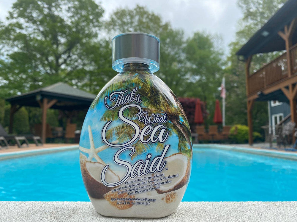 Dark Tans Exclusive That’s What Sea Said tanning-cream texture closeup emphasizes aloe and passionfruit for smooth skin.