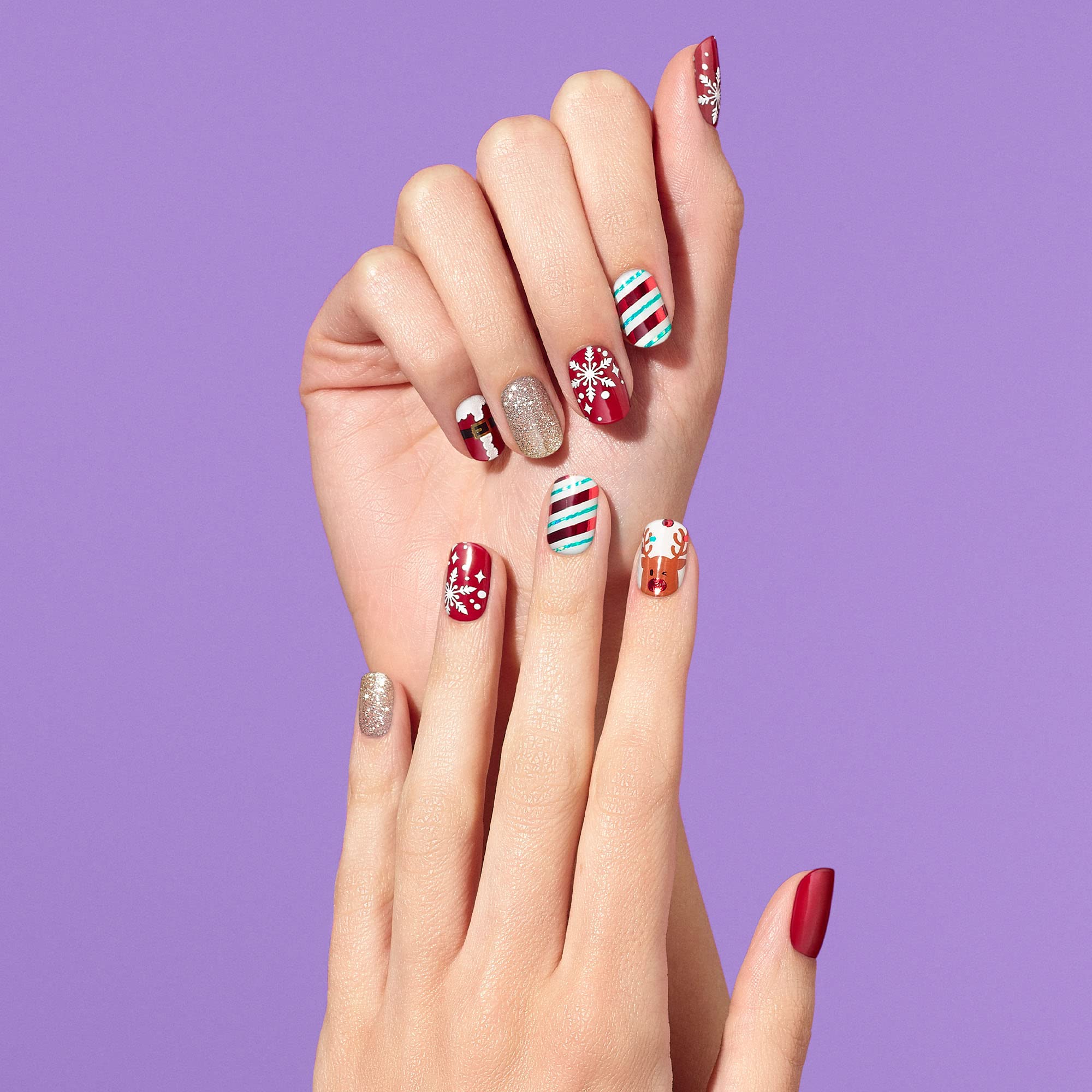 Dashing Diva gloss strips with snowflakes deliver high-shine festive nail art.