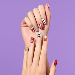 Dashing Diva gloss strips with snowflakes deliver high-shine festive nail art.